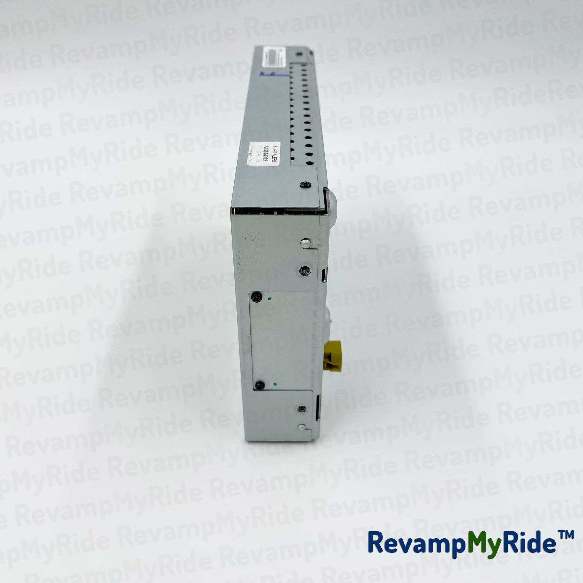 Electrical component on a textured white background with 'RevampMyRide' branding.
