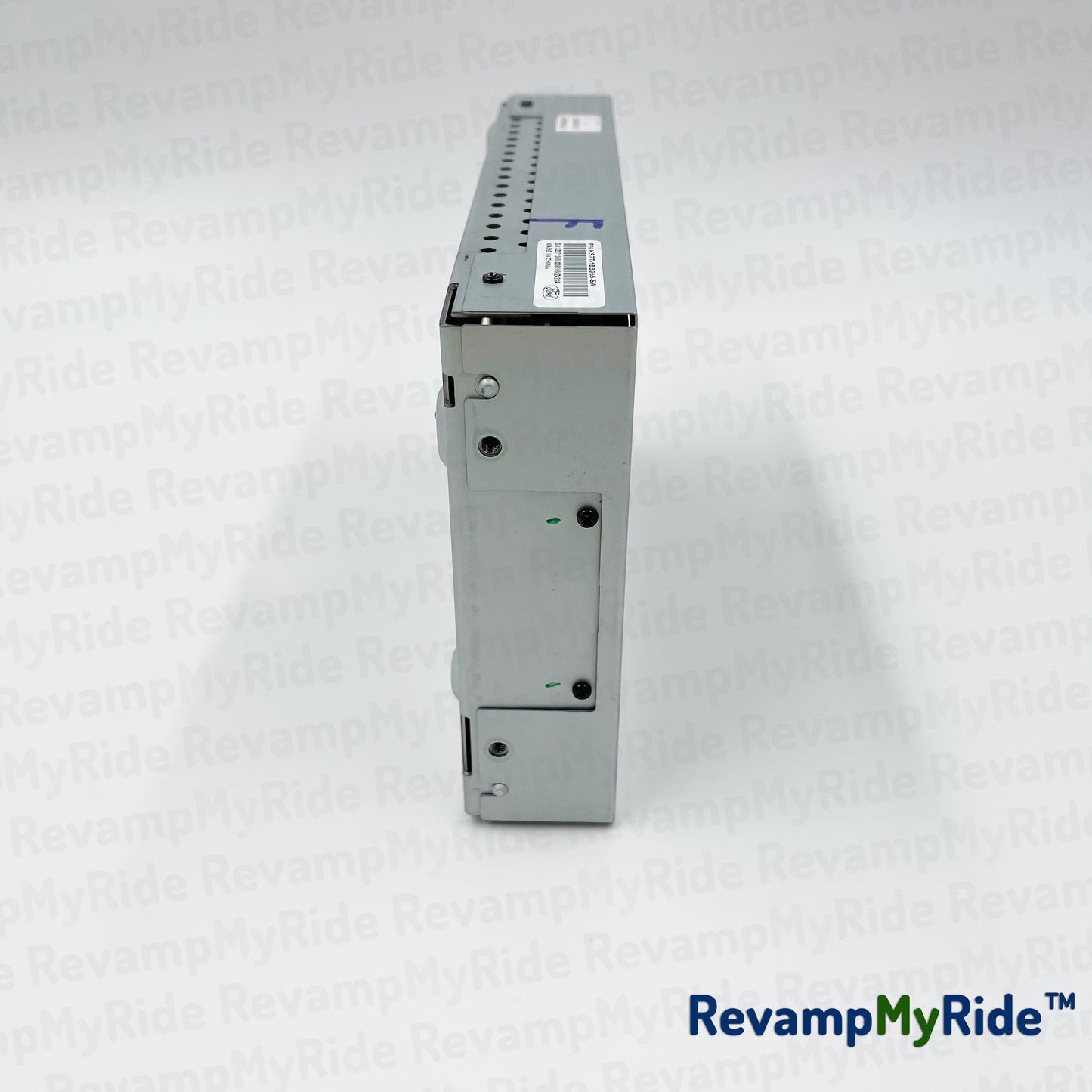 Electrical component on a white textured background with 'RevampMyRide' branding.